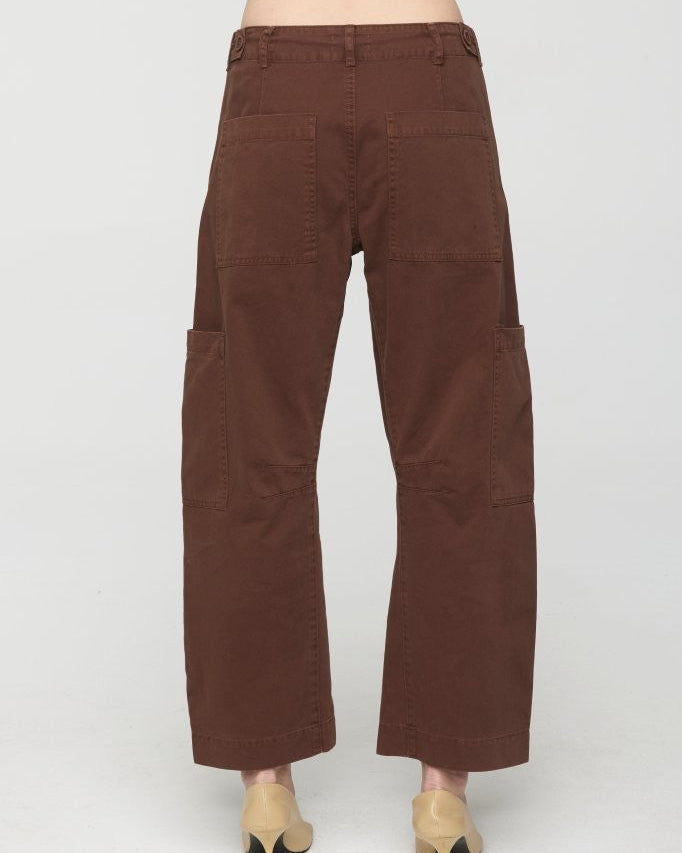 Brown wide-leg pants worn by a person on a white background