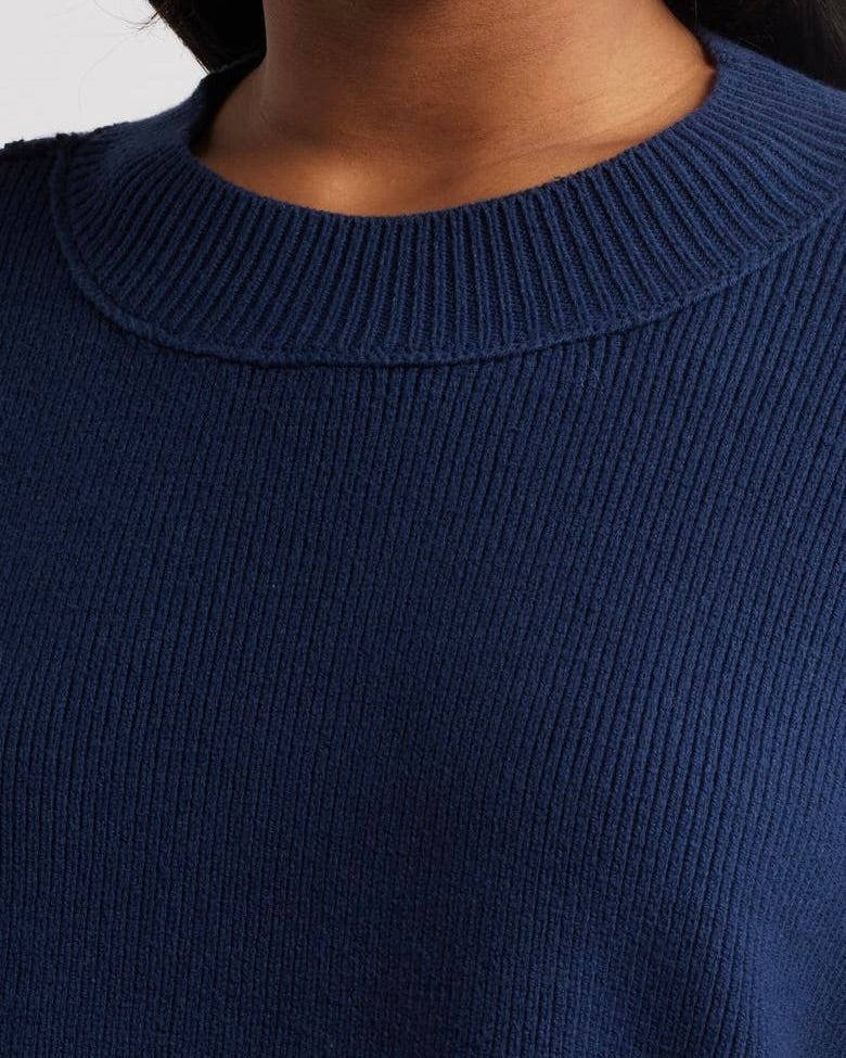 Close up of the Free People Easy Street crop pullover sweater in navy.