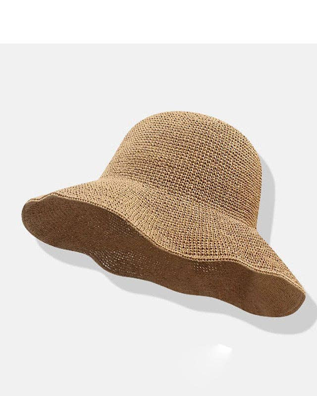 Brown woven sun hat on a light gray background