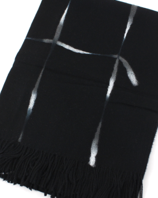 A black scarf with a modern abstract design of metallic silver vertical stripes and a cross-like pattern, finished with a fringed hem.