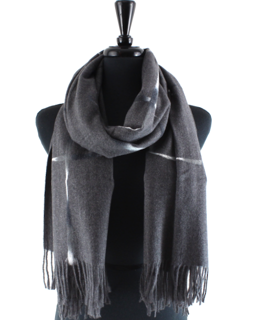 A dark gray wool scarf with a subtle white stripe pattern and fringed ends, draped on a black mannequin torso against a white background.