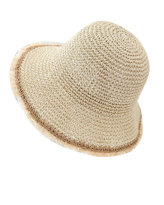 Heart-shaped straw hat on a white background