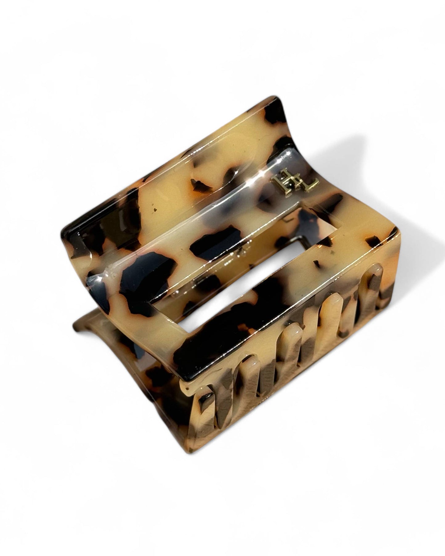 Tortoiseshell hair clip on a white background