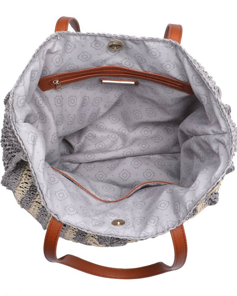 Gray textured bag with brown leather straps on a white background