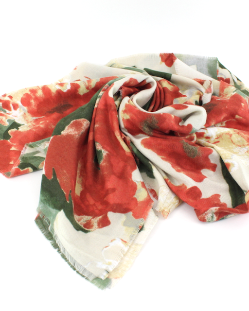 Floral patterned scarf with red, green, and white colors on a white background