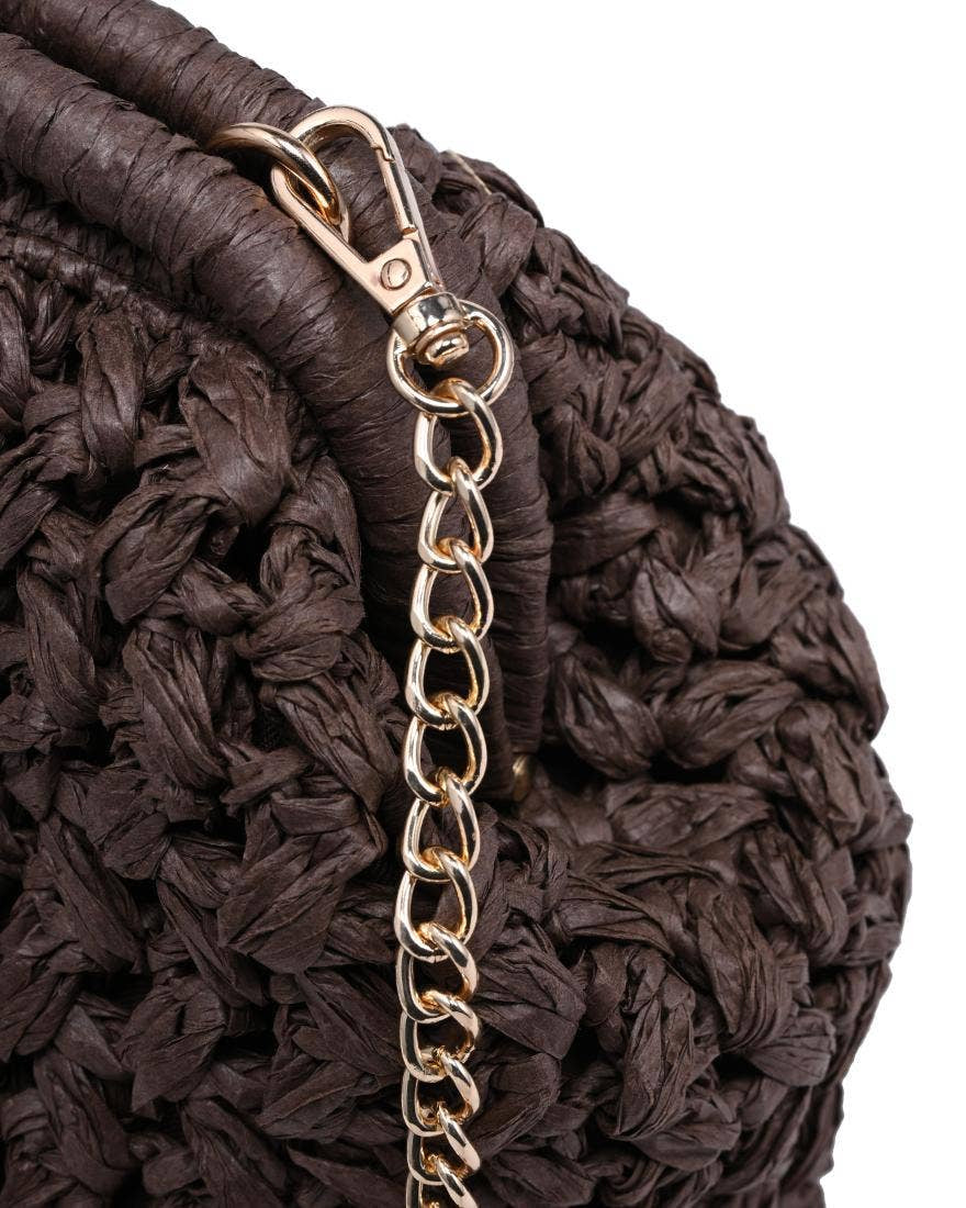 Close-up of a brown textured bag with a gold chain strap on a white background