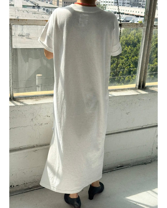 Back view of model wearing the Le Bon Shoppe Her Dress facing towards a window
