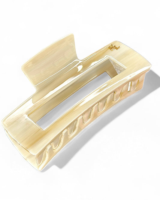 Beige hair clip on a white background
