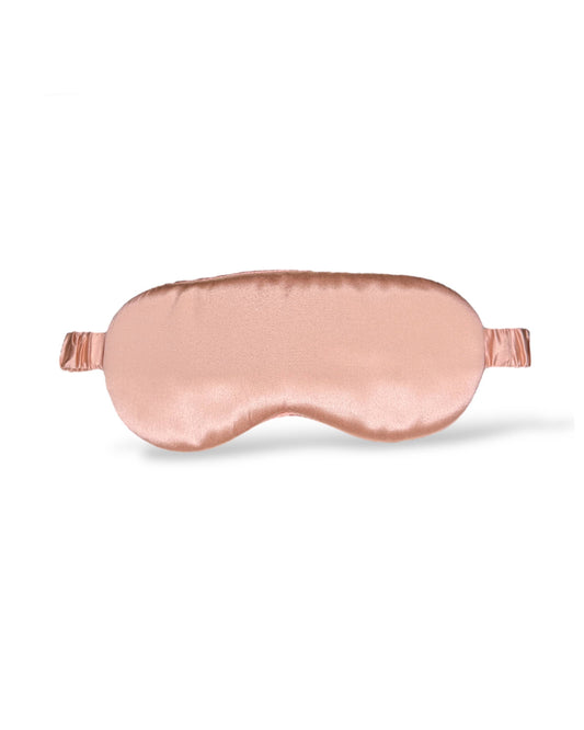 Rose gold HoneyLux silk sleep mask on a white background