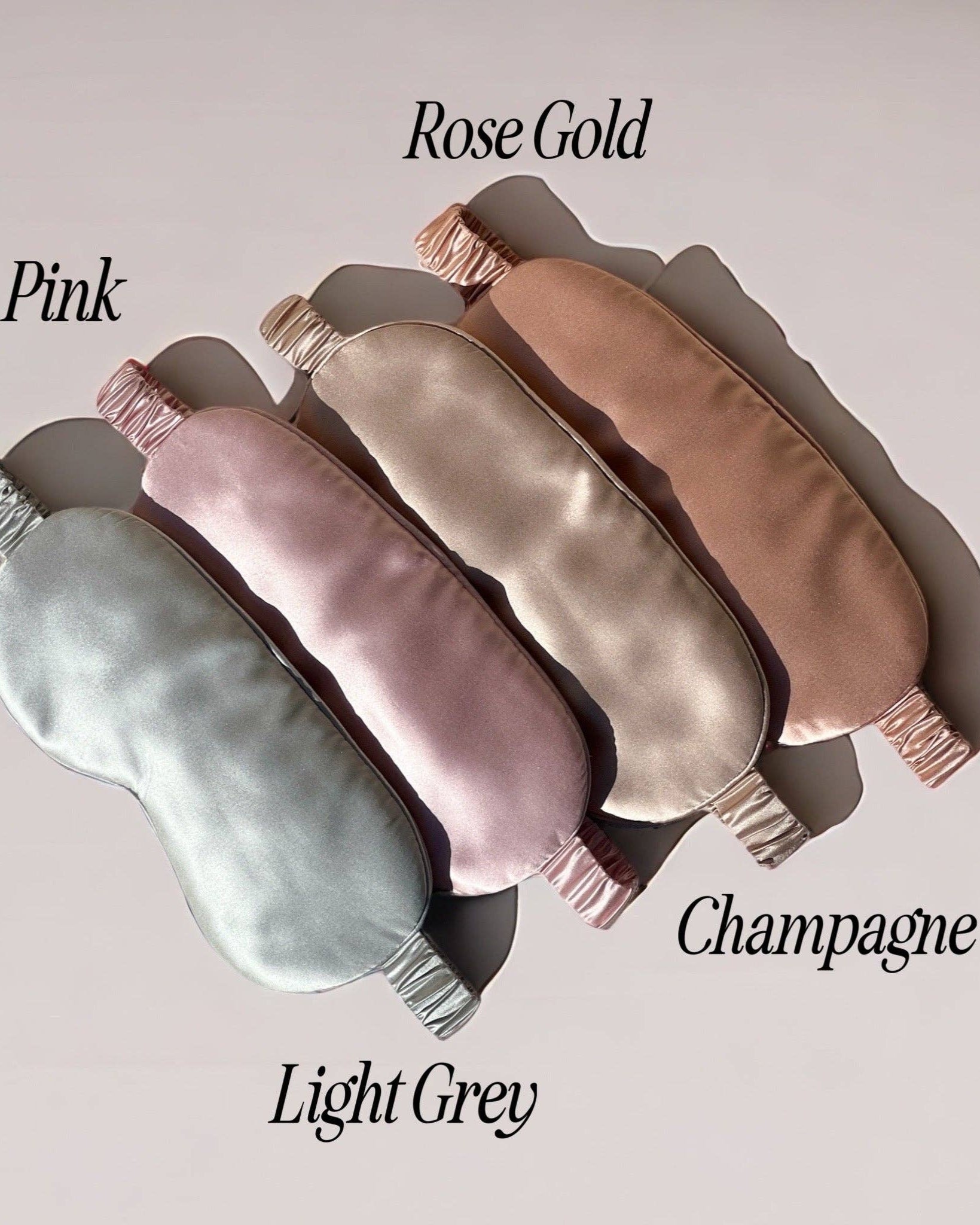 Set of the HoneyLux silk eye masks in various colors on a light background