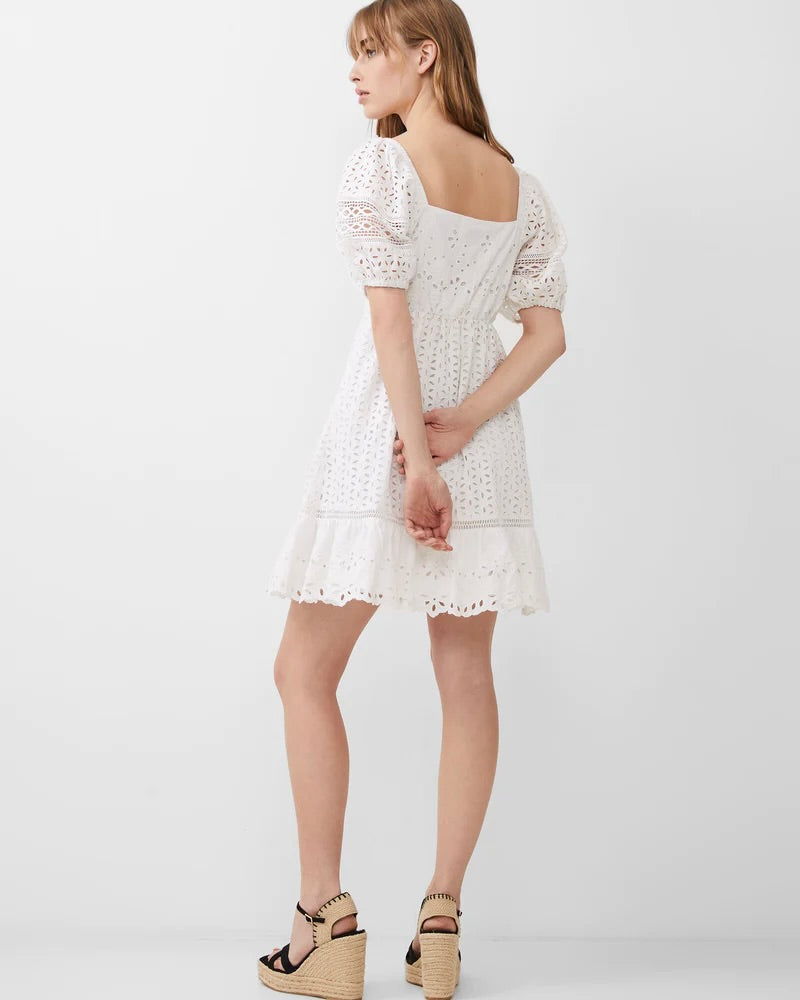 Model wearing French Connection Alissa Cotton Broderie Lace Dress wearing black sandals on a white Background