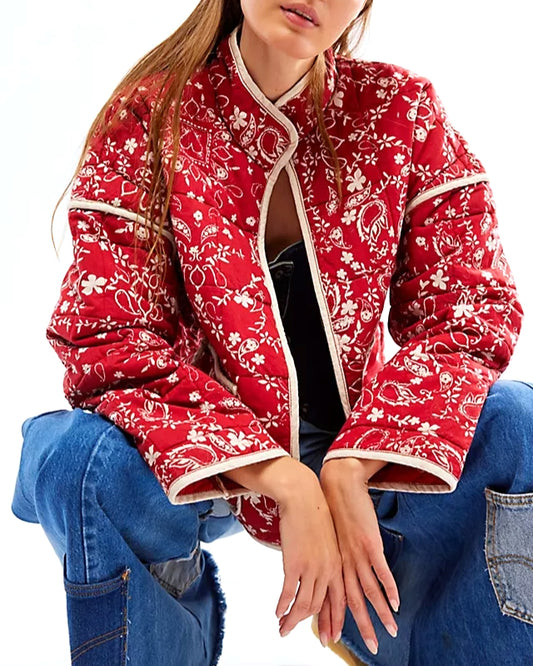 Model wearing Rosa Clothing Plants Printed Red Jacket Wearing Jeans on a white background