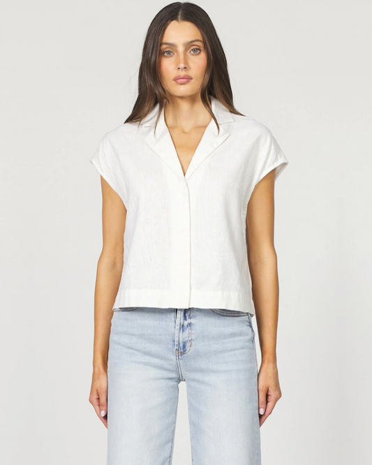 Front view of the Dear John Cruz shirt in white on a model wearing jeans standing in front of a white background