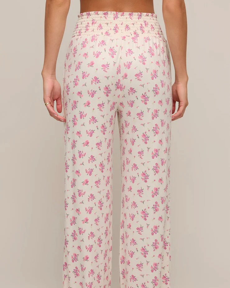 Back view of the Z Supply Dawn Ditsy Pointelle Floral Pant worn by a model in front of a white background.