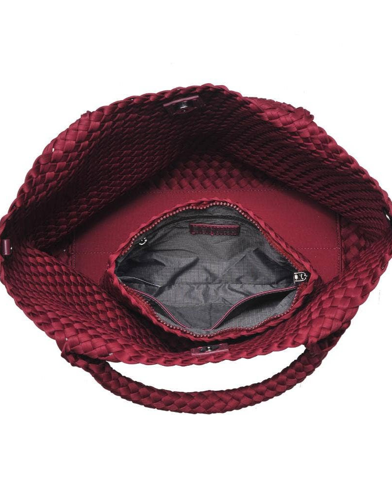 Red textured handbag on a white background