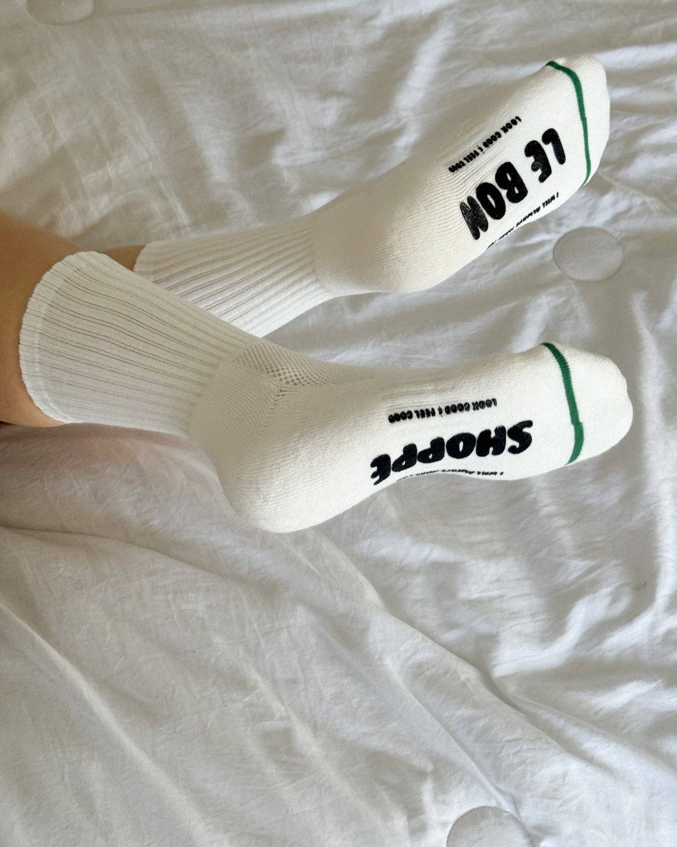White socks with black text on a white background