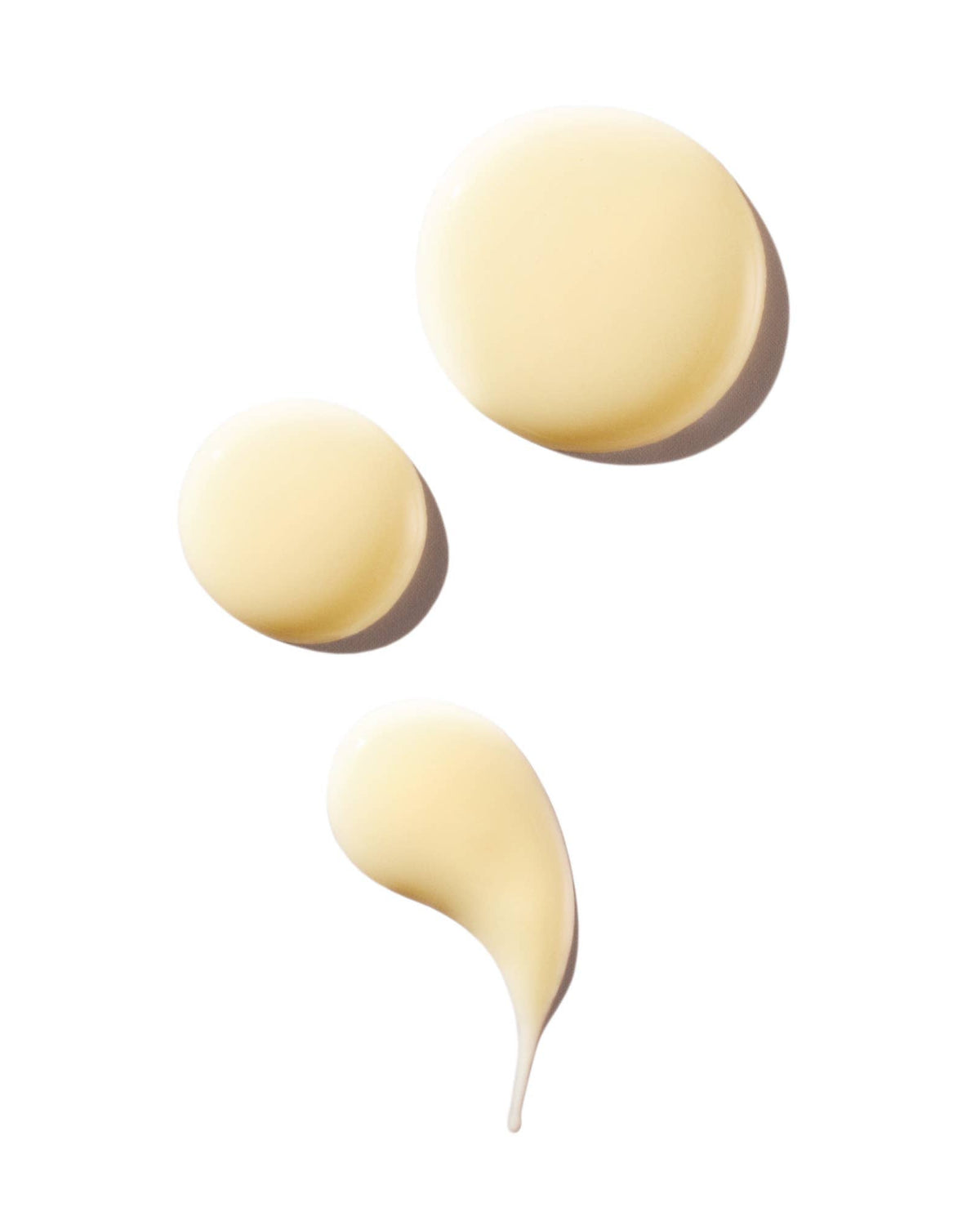 Three yellow makeup sponges on a white background