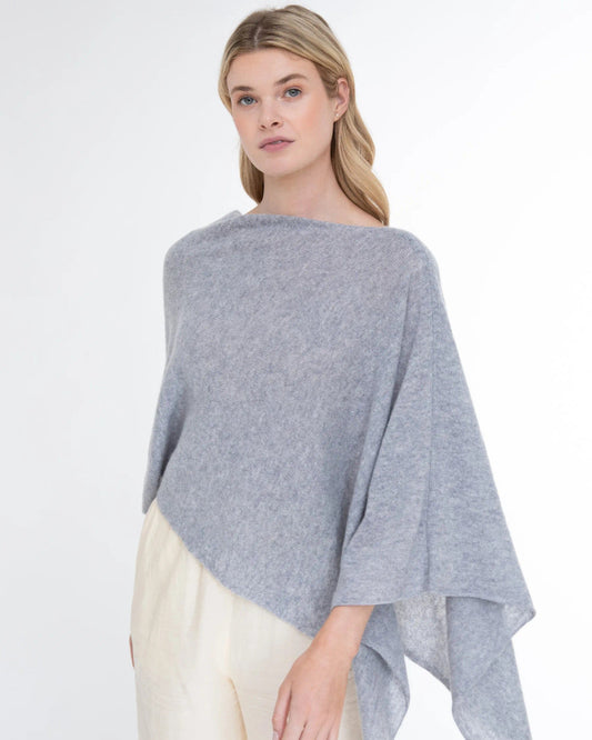 Woman wearing the Alashan Cashmere 100% Cashmere Dress Topper in Harbor against a white background