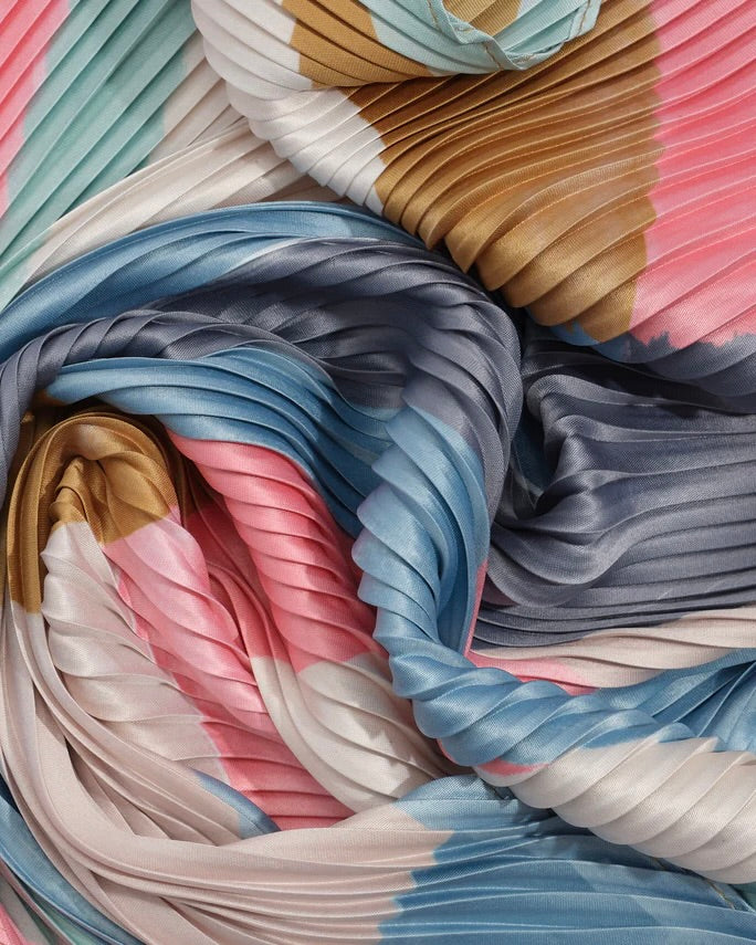 Close-up of pleated fabric with multicolor pattern