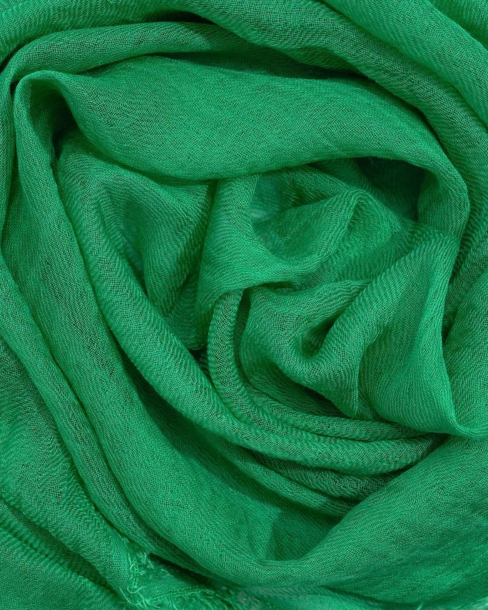 Close-up of green fabric with a textured pattern