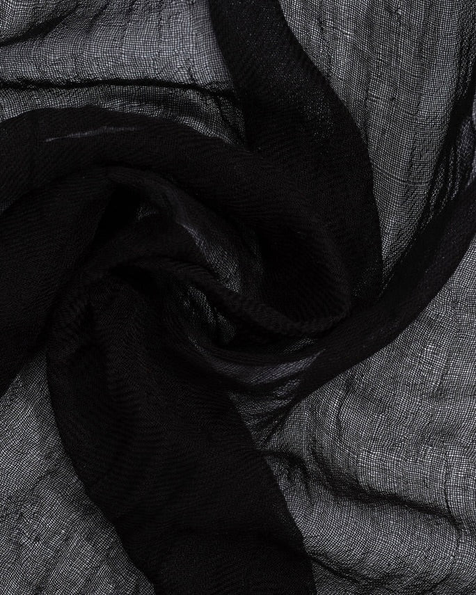Close-up of black and gray fabric with a textured pattern