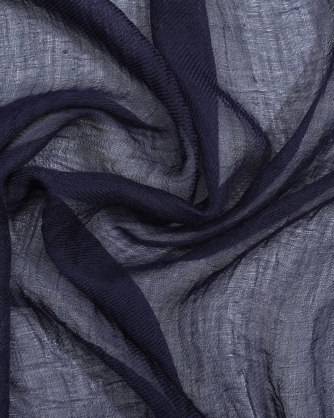 Close-up of dark blue fabric with a textured pattern