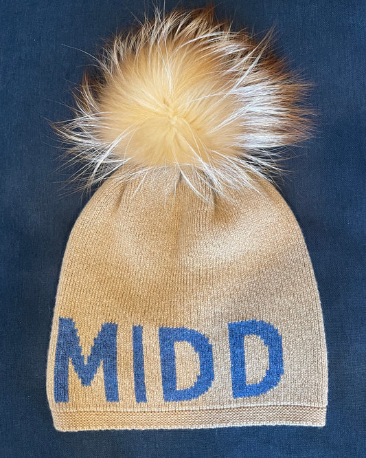Image of Alashan Cashmere Middlebury Vermont hat on a blue background