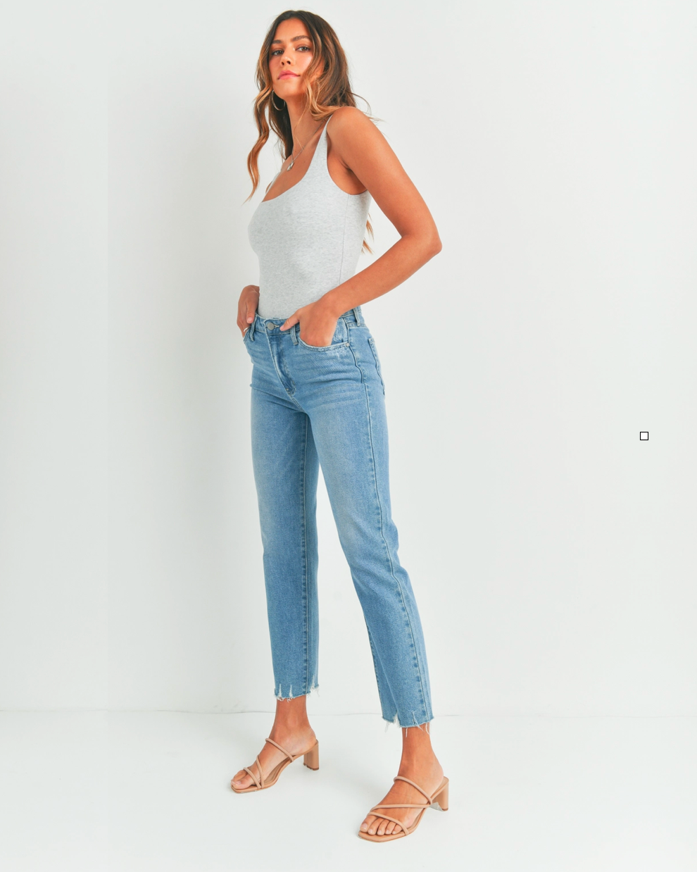 Model wearing JBD The Vintage Straight denim jeans wearing white tank tip and brown sandals on a white background