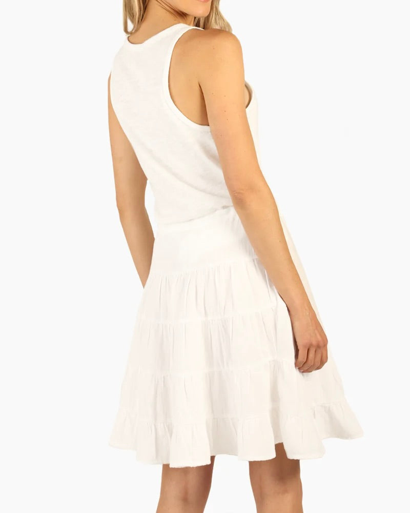 Model Wearing Dylan White Gauze Sophie Skirt wearing a white tank top on a white background