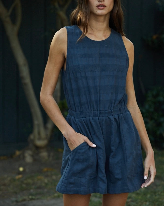 Model wearing By Together Stripes on Stripes Romper 