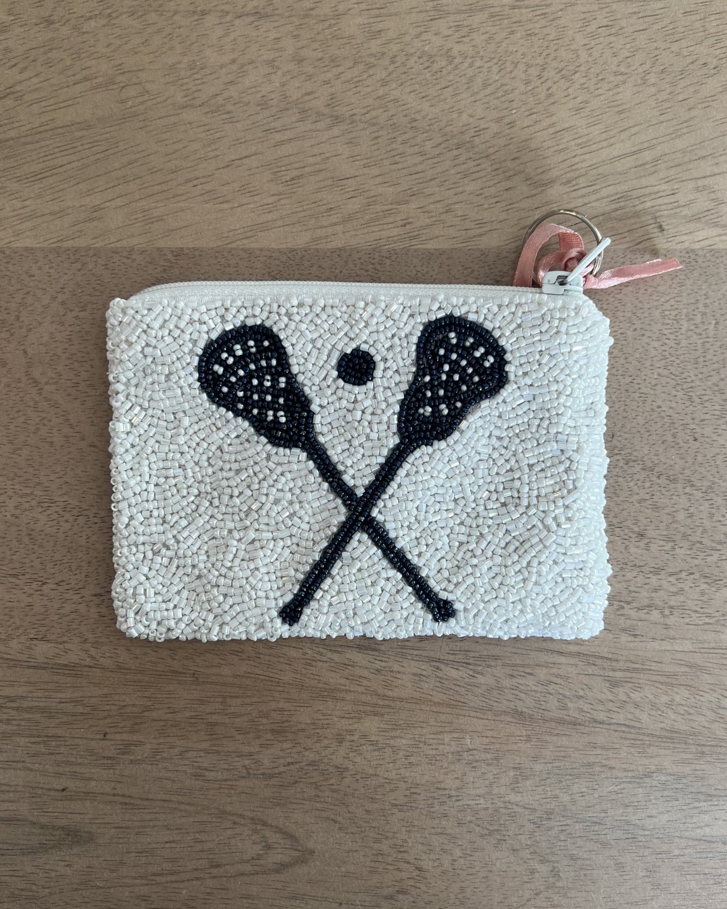 Image of Middlebury College Lacrosse White/Navy Coin purse on a brown background