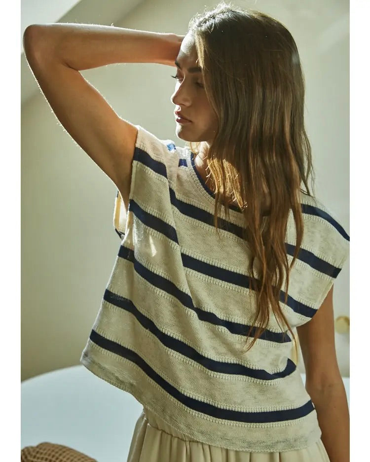 Model wearing By Together Knit Hacci Stripped Neck Sleeveless Top standing in a bathroom