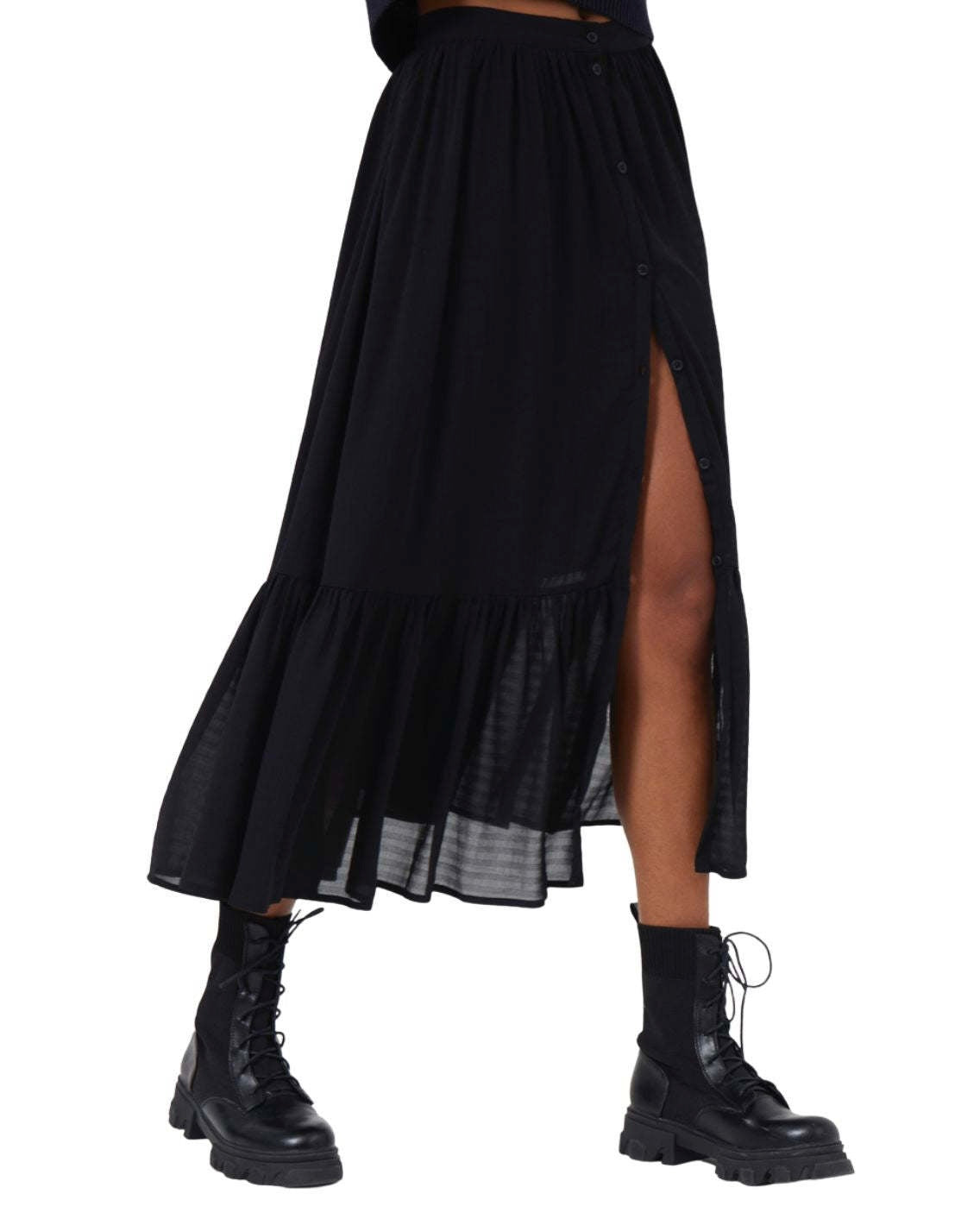 Model wearing French  Connection Anitta Cora Drape Midi Skirt in Moodless Night wearing black boots on a white background