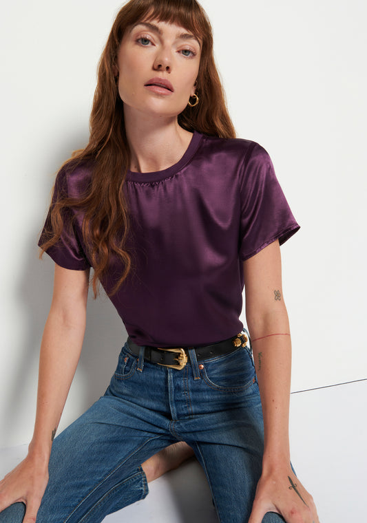 Model wearing Nation Marie Boxy Crop in color Fig Jam wearing jeans on a white background