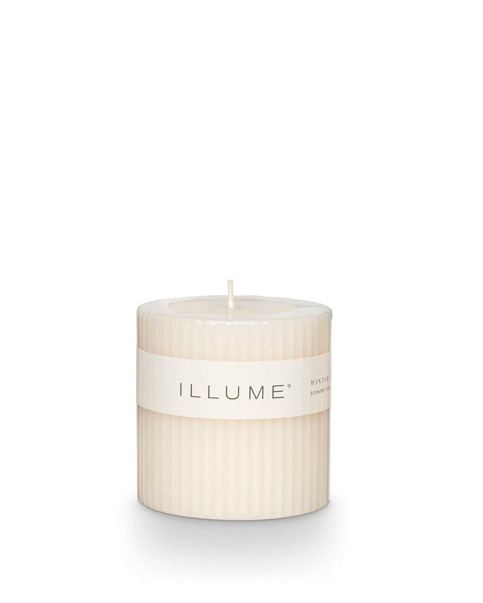 image of ILLUME winter white small fragranced pillar candle on a white background
