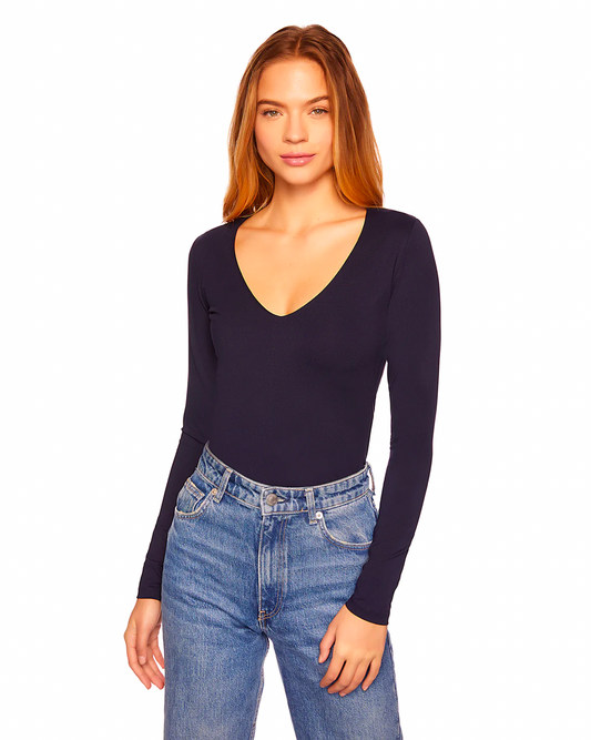 Model wearing Susana Monaco Midnight Sexy V 10"  Shirt wearing jeans on a white background