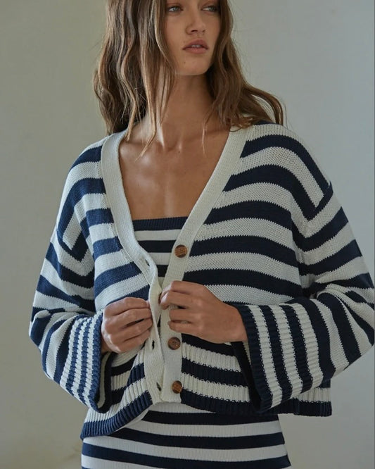 Model wearing By Together Knit Striped Cardigan Blue/White wearing matching dress on a white background