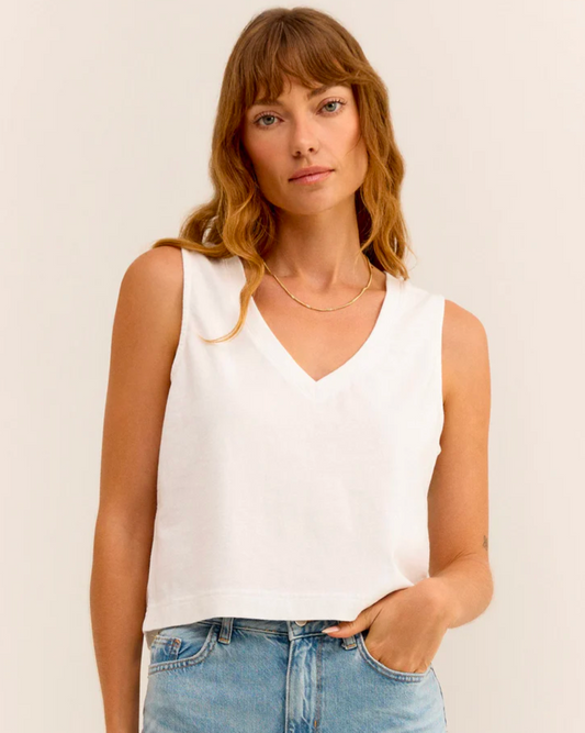 Model Wearing Z Supply White Sloane V-Neck Top wearing jeans on a white background 
