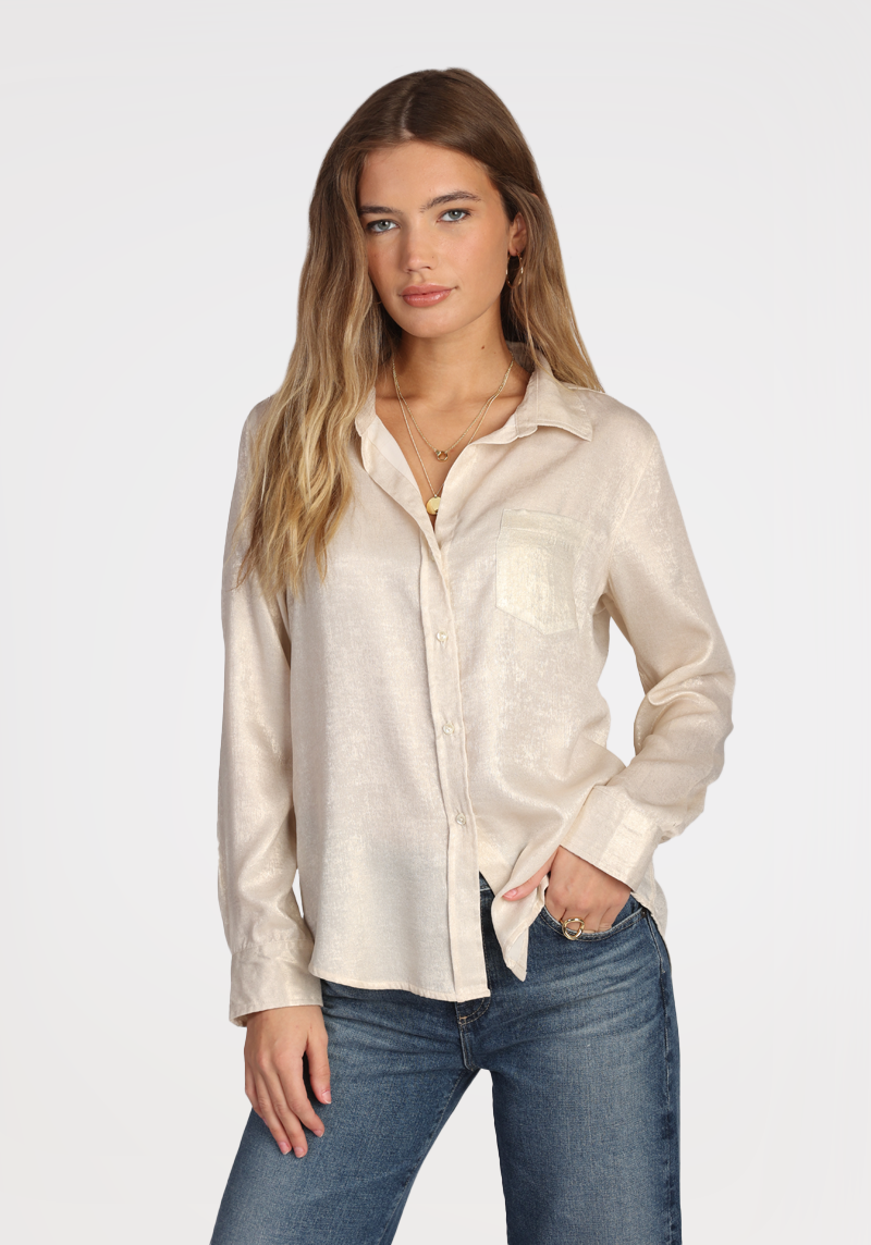 Model wearing Dylan subtle Shimmer ivory Siena Shirt wearing jeans on a white background